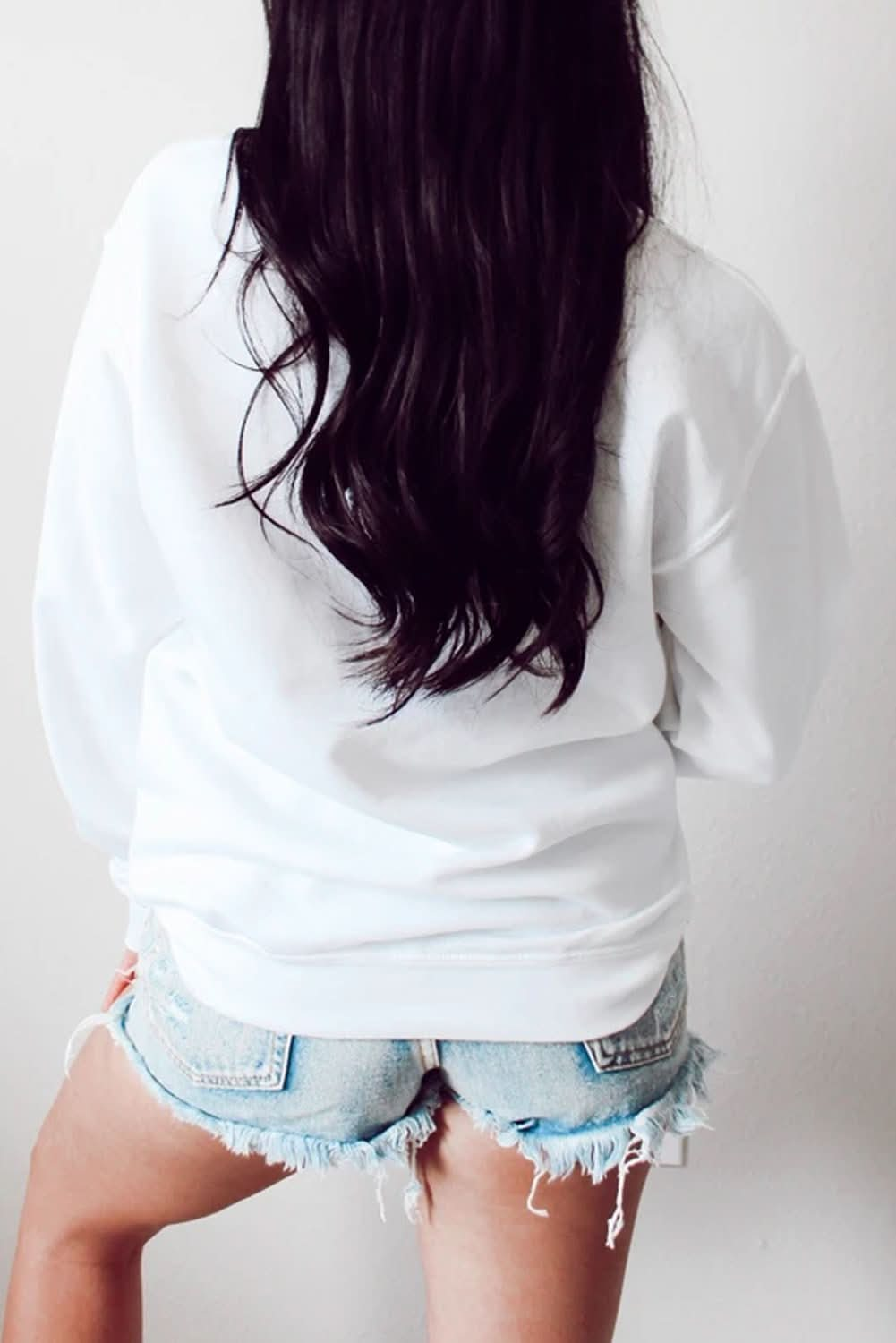 "Back view of Drip Drip Leopard Print Pullover Sweatshirt in white."