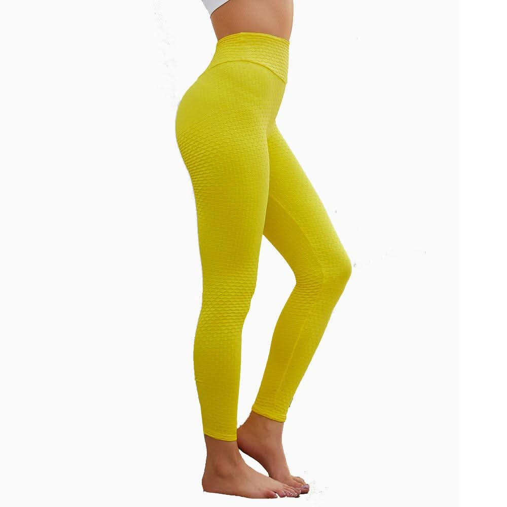 "Model wearing yellow high-waist yoga leggings, side view."