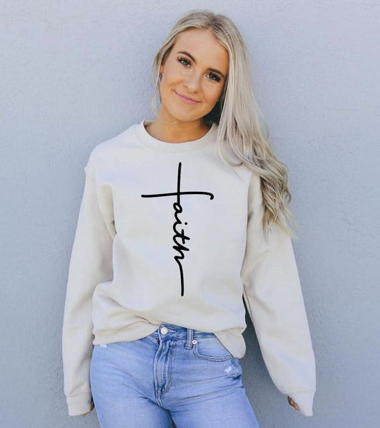 "Front view of Faith Sweatshirt in sand color with Christian cross graphic."